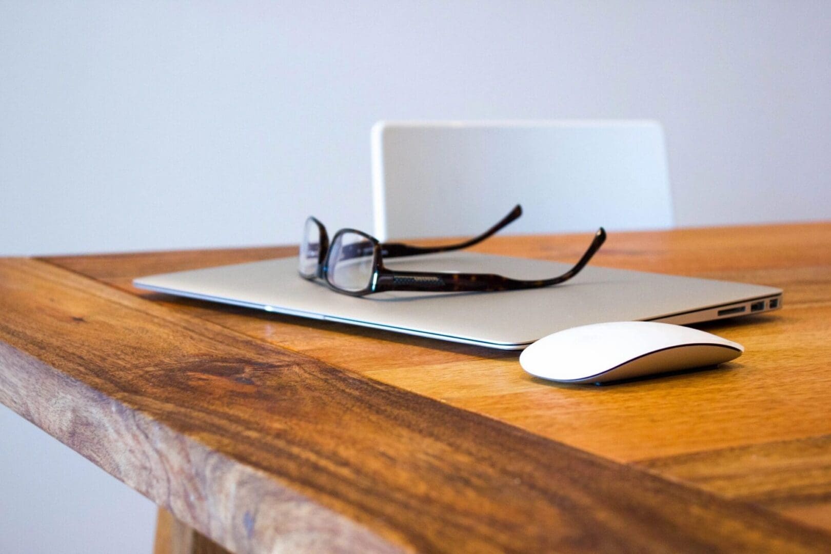 Laptop and glasses with a mouse